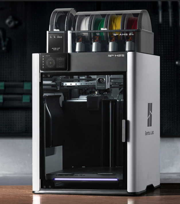 Bambu Lab H2S 3D printer with filament spools on a dark background