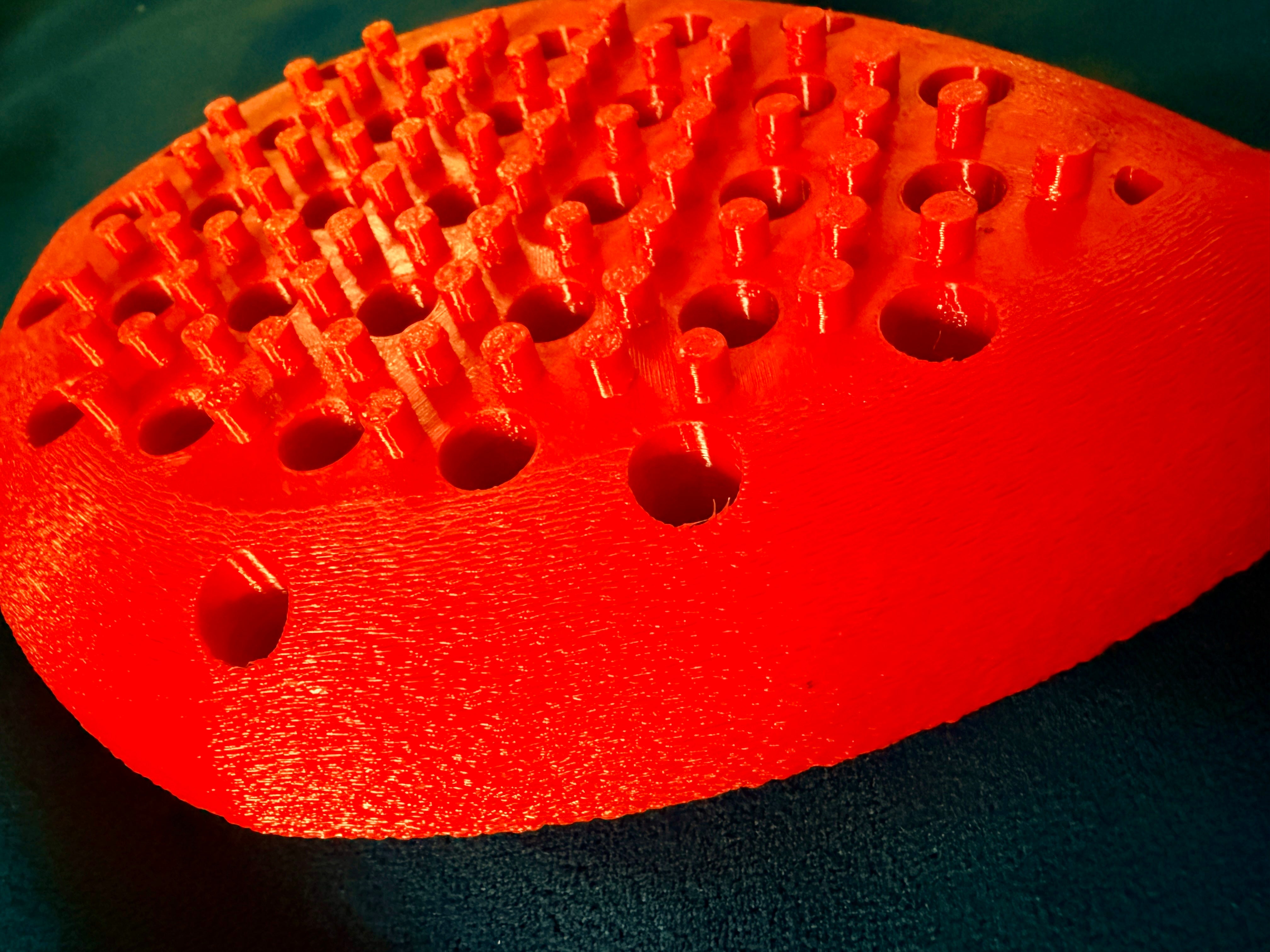 Close up of the Hera paddle in the Best tier and red color.