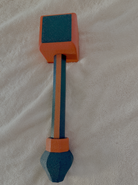 Black and red Hephaestus hammer on a beige background.