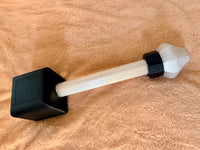 Tuxedo Hephaestus hammer on a brown background.