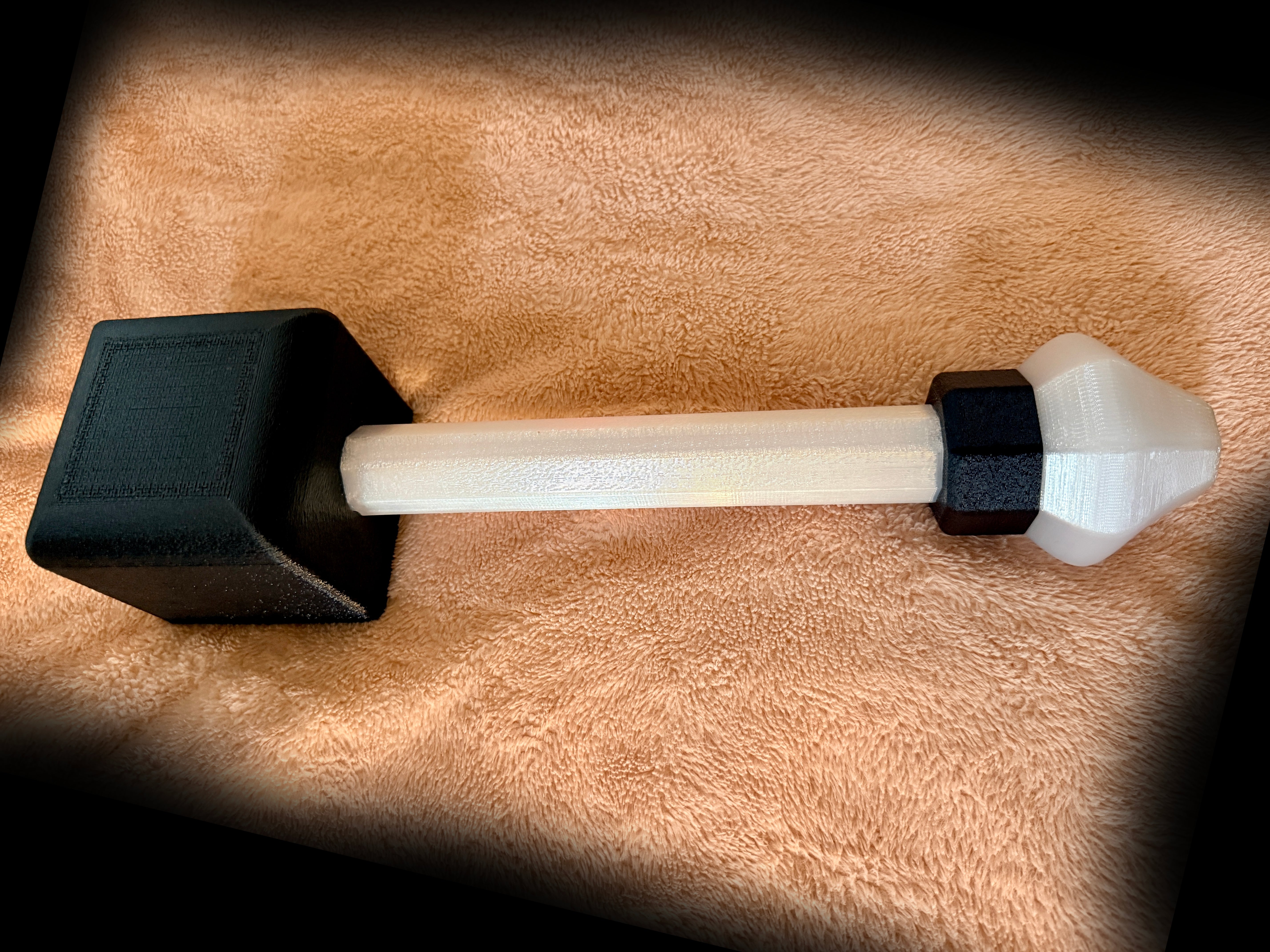 Tuxedo Hephaestus hammer on a brown background.