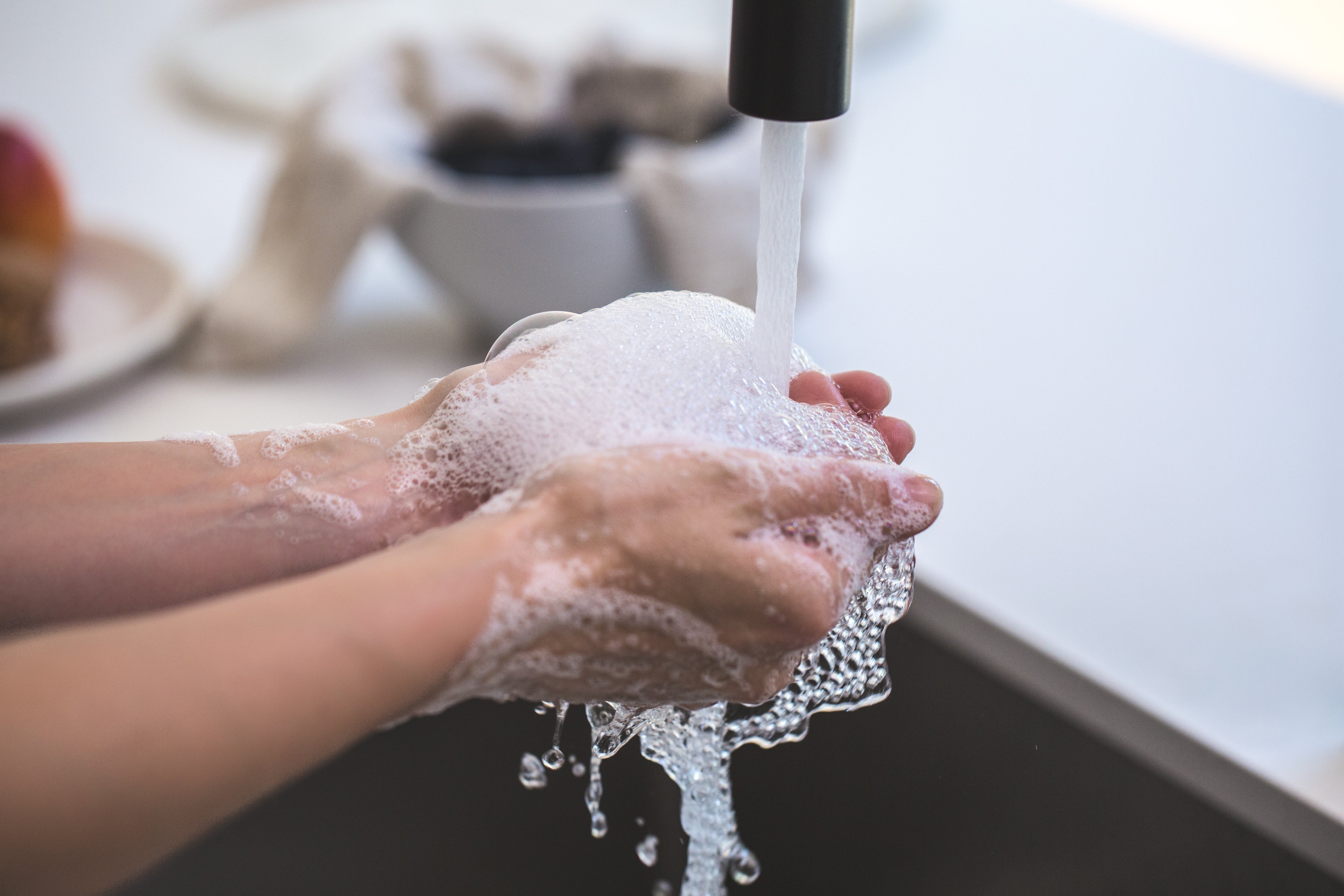 rinsing-soapy-hands-in-water.jpg